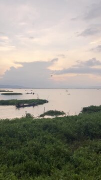 Boats on a Lake at Sunset