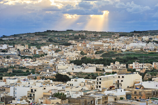 View of Victoria from Cittadella, showing buildings and landscape in Malta during the day