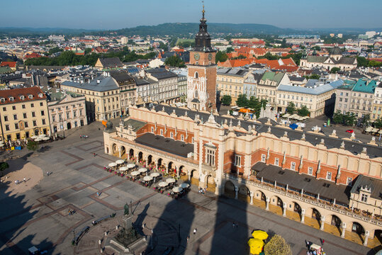 View of adam mickiewicz monument, cloth hall, and town hall tower from st. mary&rsquo;s basilica in krakow, poland