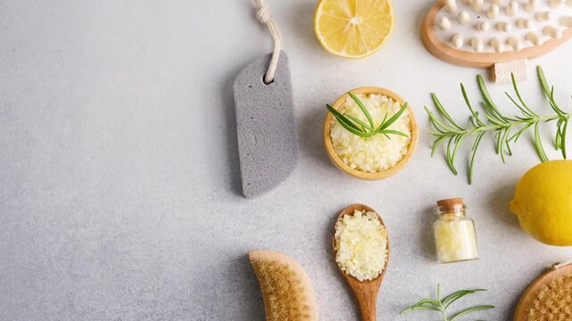 Spa bath salt with lemon and rosemary on light background