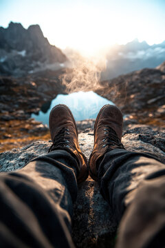 Exhausted Trekker Resting at High-Altitude Glacial Lake with Coffee and Granite Spires in Golden Hour