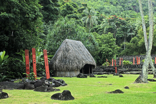 Marae Arahurahu at Paea showcases traditional Tahitian architecture surrounded by lush greenery and stone structures