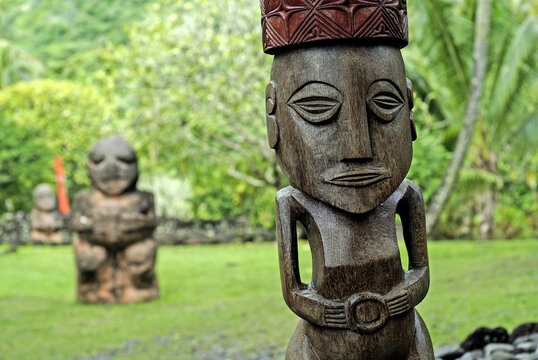Wooden carvings at Marae Arahurahu in Paea, Tahiti showcasing ancient Polynesian culture