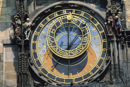 Medieval astronomical clock shows time on southern wall of Old Town City Hall in Prague, Czech Republic during daylight hours