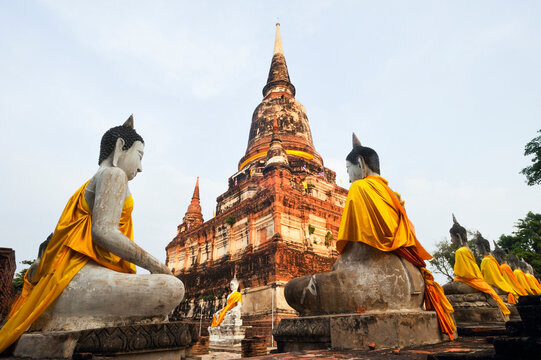 Exploring Wat Yai Chai Mongkol temple with Buddha statues and chedi in Ayutthaya, Thailand