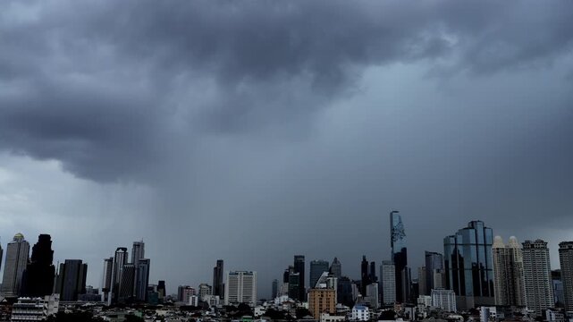 Dense cloud formations rapidly develop above Bangkok's skyscrapers before a tropical storm.