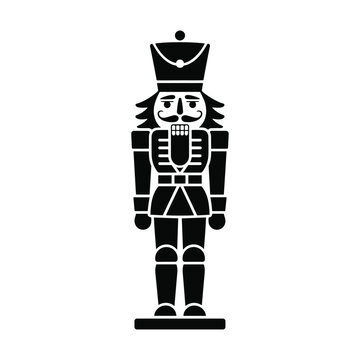 Traditional christmas nutcracker doll in uniform standing on pedestal.