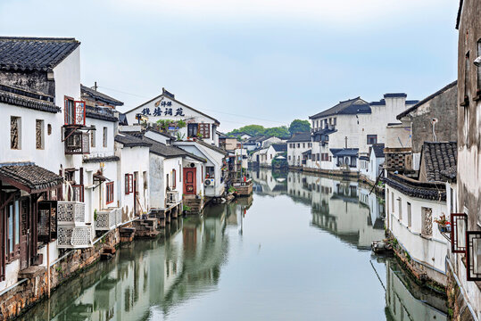 Walking along Shantang Street in Suzhou, observing traditional architecture and the calm waterway