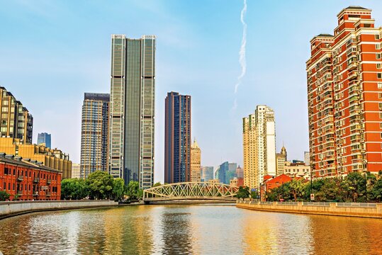 Heritage buildings and modern structures create a striking view along the waterway in Shanghai, China near Suzhou Creek