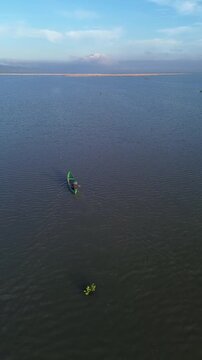 Lone Boat on Vast Body of Water