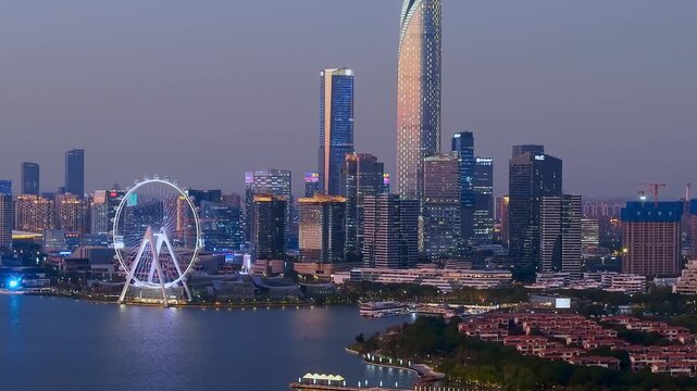 Close up of aerial night view of the city skyline of Jinji Lake and Ferris wheel in Suzhou, Jiangsu Province, China