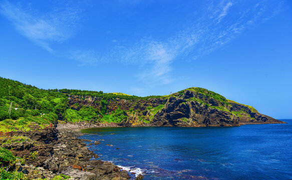 Scenic view of Udo Island with clear blue sky and rocky coastline in South Korea