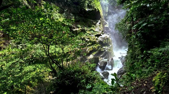 Waterfall Gorge in Ecuador Cloud Forest with Mist, Green Vegetation, Rocky Canyon Walls and Scenic Tropical Nature Travel Landscape