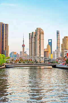 Skyline view of Shanghai during magic hour with soft light reflecting on Suzhou Creek in Shanghai, China