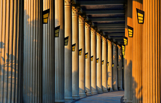 Corridor of Roman columns during golden hour at Xinqiao Civic Square in Shenzhen, Guangdong, China
