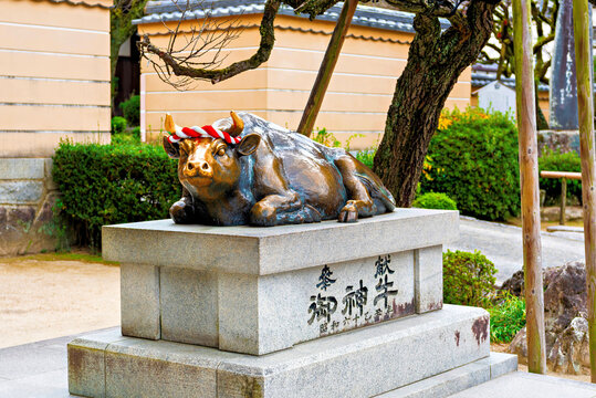 Bronze ox statue at Dazaifu Tenmangu shrine in Fukuoka, capturing cultural heritage in Japan