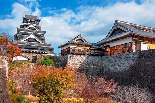 Kumamoto Castle displays vibrant autumn colors in Kumamoto City, Kyushu, Japan