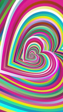 Seamless vertical video of a rainbow heart pattern swirl. Geometric colorful graphic spiral with a psychedelic look.