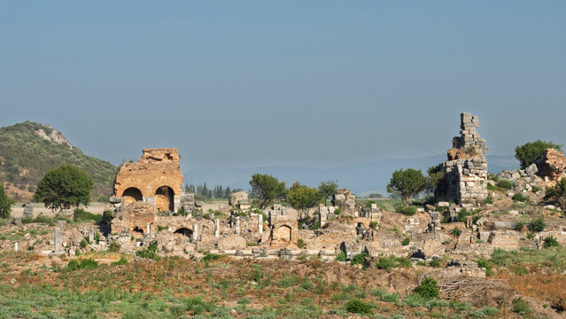 Exploring the ruins and structures at Ephesus archaeological site in Turkey amidst nature and historical significance