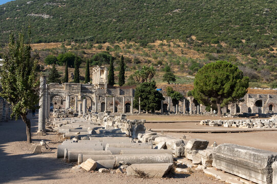 Exploring the Lower Agora and Celcus Library at Ephesus archaeological site in Turkey with historical ruins and distant hills