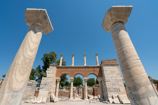 Exploring the remains of the Basilica of Saint John in Selcuk, Turkey under clear blue sky and bright sunlight