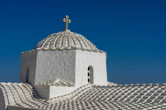 Church of Panagia i Diasozousa stands out against the blue sky in Chora, Patmos, inviting visitors to explore its history and architecture