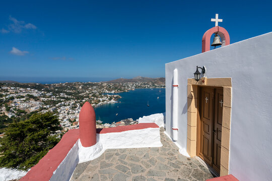View of Agia Marina and Church of Prophet Elias on Leros Island with a clear sky and blue sea in the background