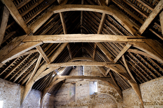 Restored 14th-century tithe barn roof structure in Lacock