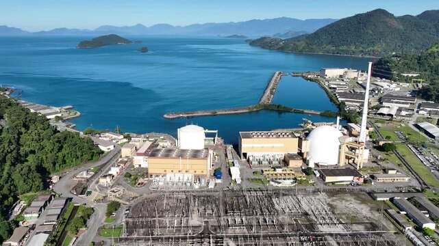 Nuclear energy as an alternative energy source. Operational nuclear power plant. Aerial view. establishing shot.