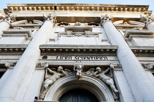 Historic architecture in Venice featuring detailed sculptures and columns on a prominent building front
