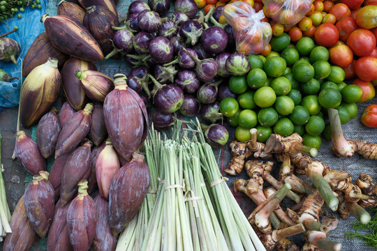 Fresh vegetables for sale at a local market with various produce options in Luang Prabang, Laos