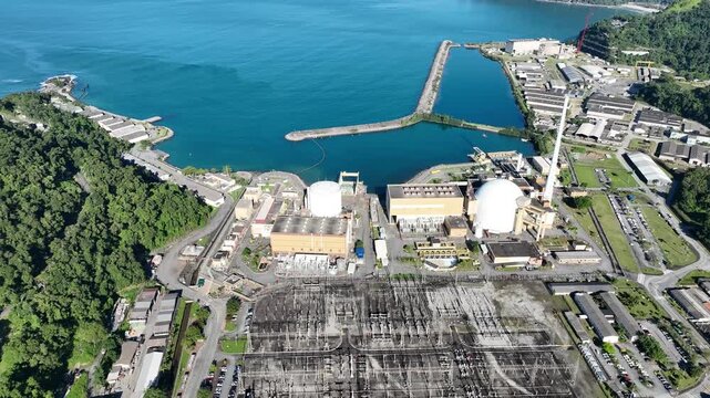 Nuclear energy as an alternative energy source. Operational nuclear power plant. Aerial view. establishing shot.