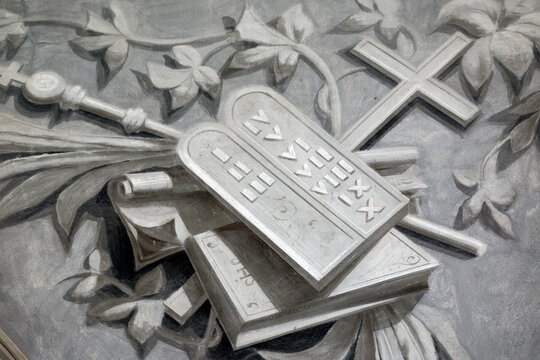 Tablets of the law depicted in Saint Agatha Church in Rumilly, France, showing the 10 commandments and religious symbols