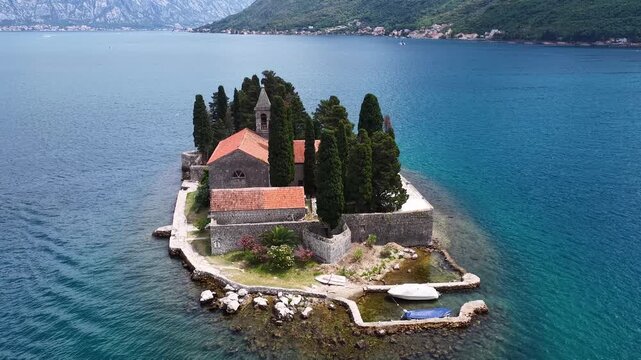 Montenegro. Aerial panoramic view of islands in the Bay of Kotor, featuring Our Lady of the Rocks Church and the Saint George Benedictine Monastery, Serene coastal landscape scene. Vast mountain bay.
