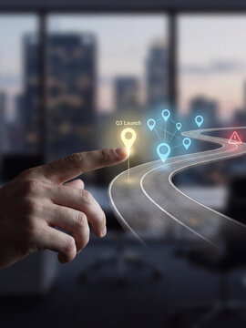 Business strategy and roadmap planning with a digital interface showing a q3 launch point and a winding path towards future goals