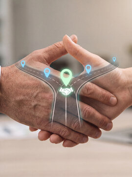 Business handshake with a digital road map overlay representing partnership and strategic direction
