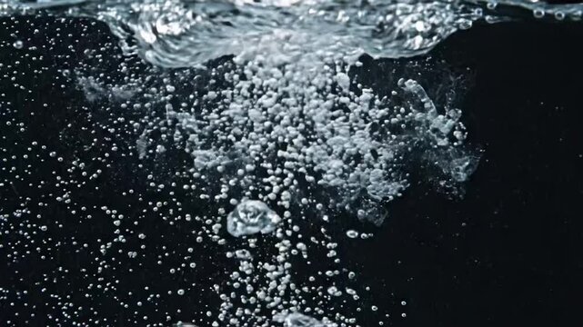 Bubbles rise and explode in water with loopable action for close observation