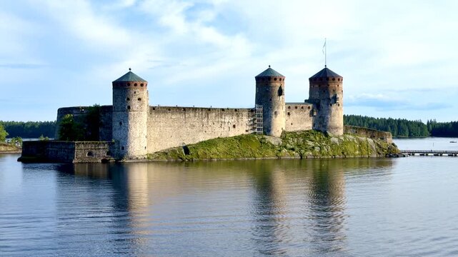 Olavinlinna Medieval Castle Seen from Lake on Summer Day
