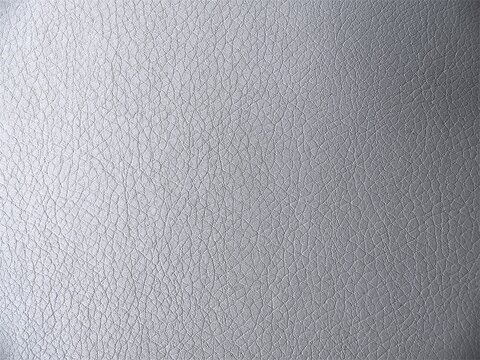 Macro texture of premium grey leather, elegant faux leather textile pattern background with metallic sheen.