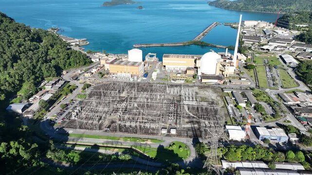 Nuclear energy as an alternative energy source. Operational nuclear power plant. Aerial view. establishing shot.