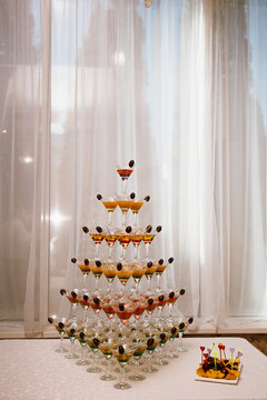Beautiful Pyramid of Delicious Alcohol Crystal Glass with Champagne. Romantic Celebrations and Party Concept
