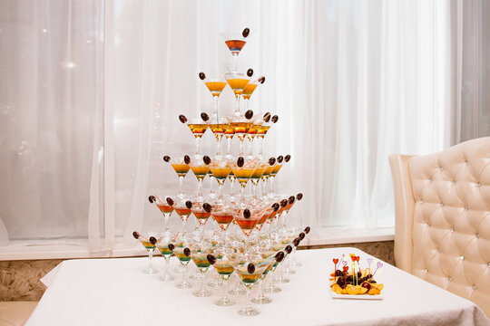 Beautiful Pyramid of Delicious Alcohol Crystal Glass with Champagne. Romantic Celebrations and Party Concept