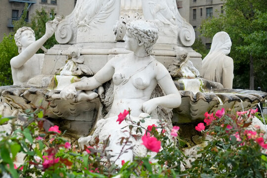 Fountain Statue with Pink Flowers