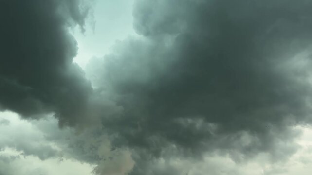 Fragment of sky with storm clouds before thunderstorm, time-lapse