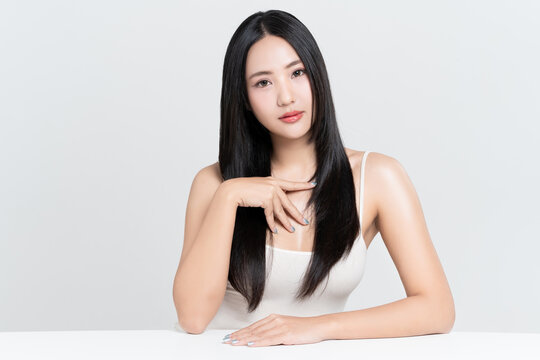 Portrait young Asian woman with beautiful long hair and makeup beauty face on white background.
