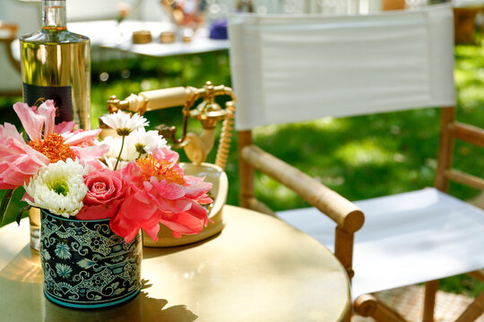 Flowers and Vintage Telephone on Outdoor Table