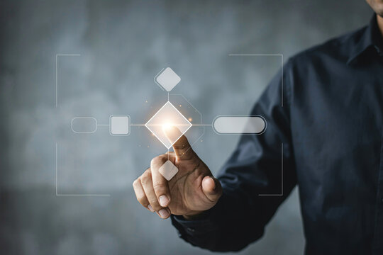 Finger touching glowing rhombus in digital flowchart representing business process automation or workflow.