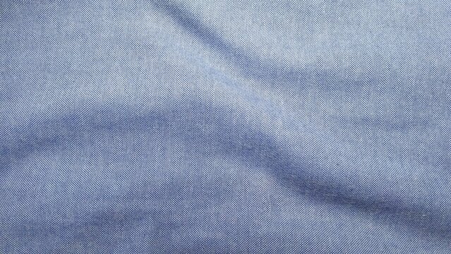 ​Blue oxford fabric texture background. Ripple cotton textile cloth close-up.