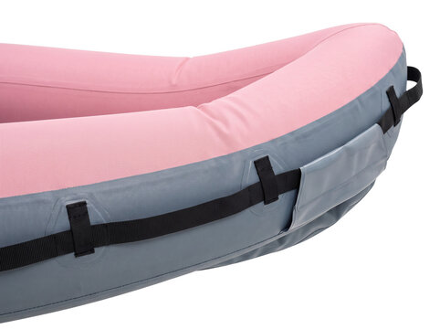 Pink inflatable raft close up on black background, durable grey packraft kayak with safety straps and handles, professional water sports gear for outdoor adventure and rafting.