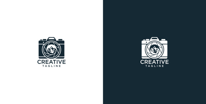 Elegant minimalist camera logo design featuring a scenic mountain landscape subtly integrated within the lens, symbolizing creative vision and the spirit of 